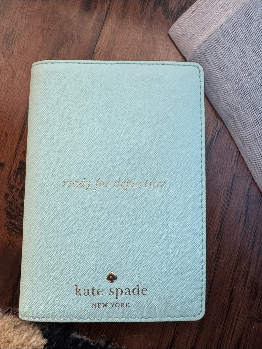 kate spade Tiffany blue passport cover with gold foil logo